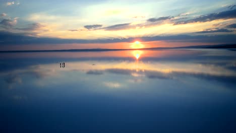 salt lake and sunset human silhouette