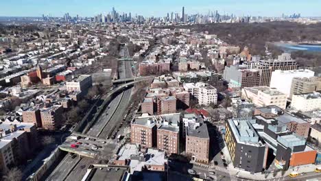 horizontal drone side-tracking shot over ocean parkway in brooklyn, capturing new york’s vibrant streets, residential buildings, and dynamic cityscape with smooth lateral aerial movement.