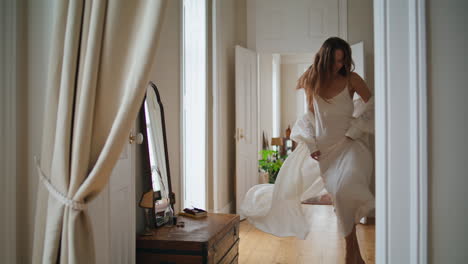 cheerful woman running morning apartment alone. positive lady dancing at house