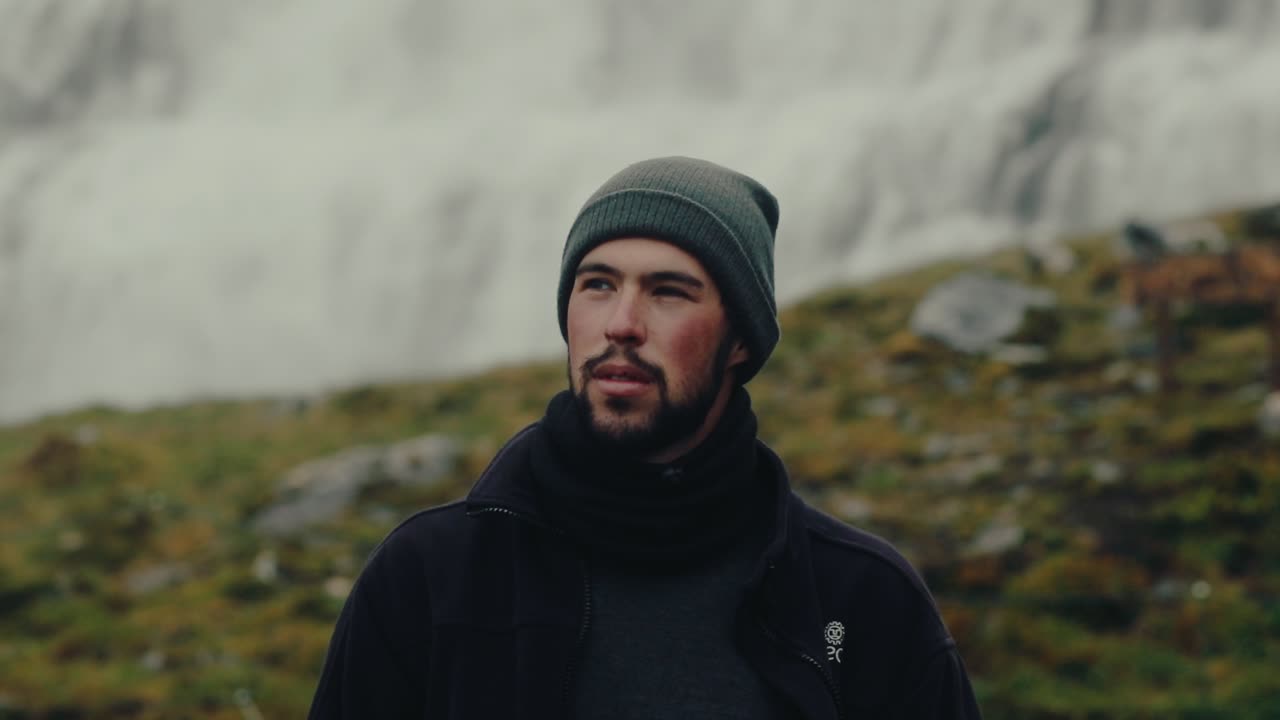 Handsome bearded man admiring Icelandic nature. Slow motion