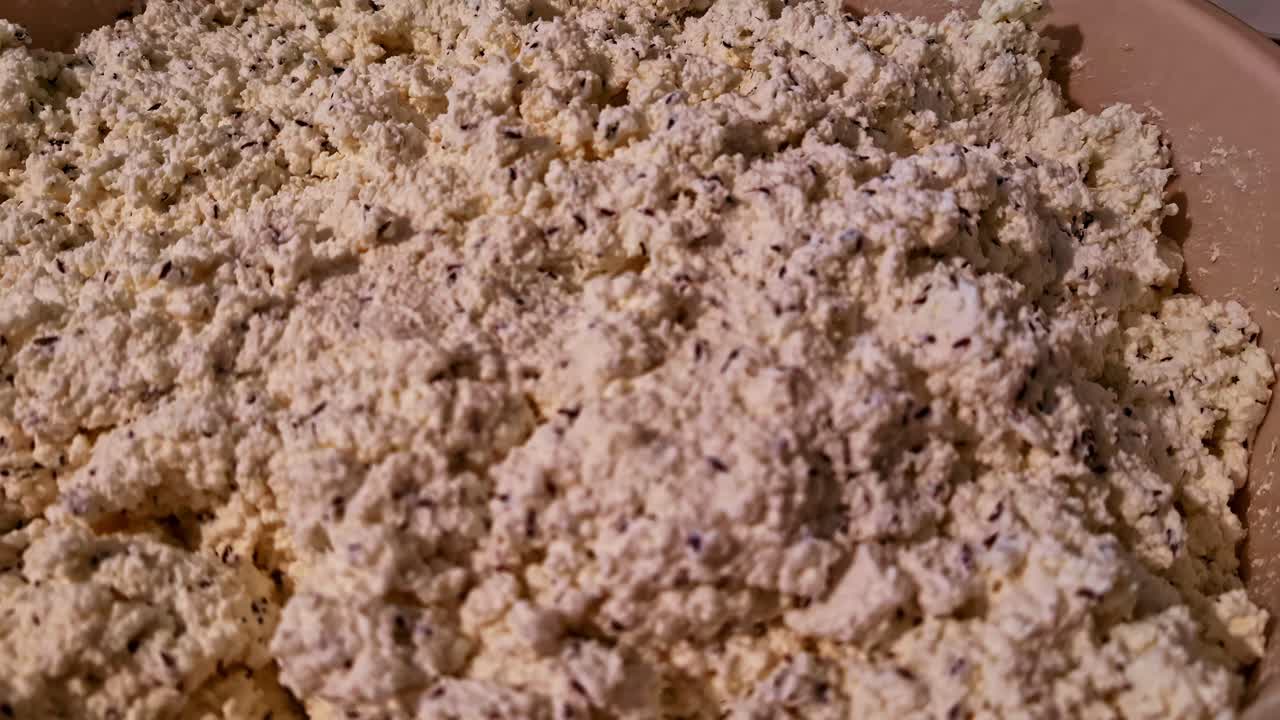 Traditional homemade cheese preparation in Cesis, Latvia. Recorded during the summer solstice