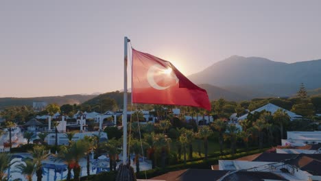 turkish flag over a resort at sunset