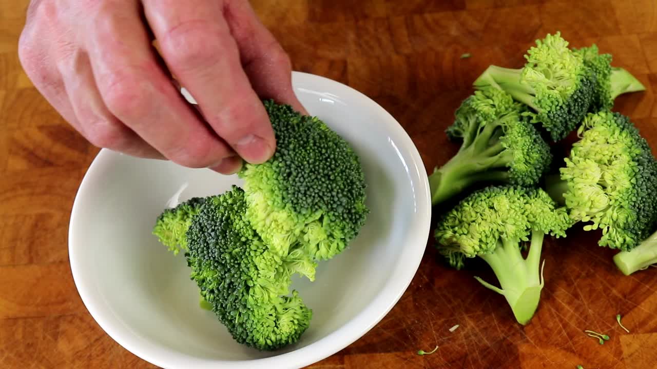Placing Broccoli Florets in to a Bowl