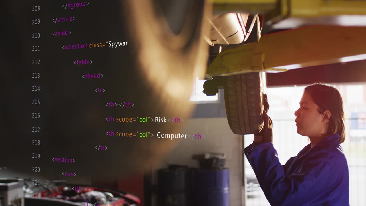 Mechanic using computer, working on car with animation overlay in garage