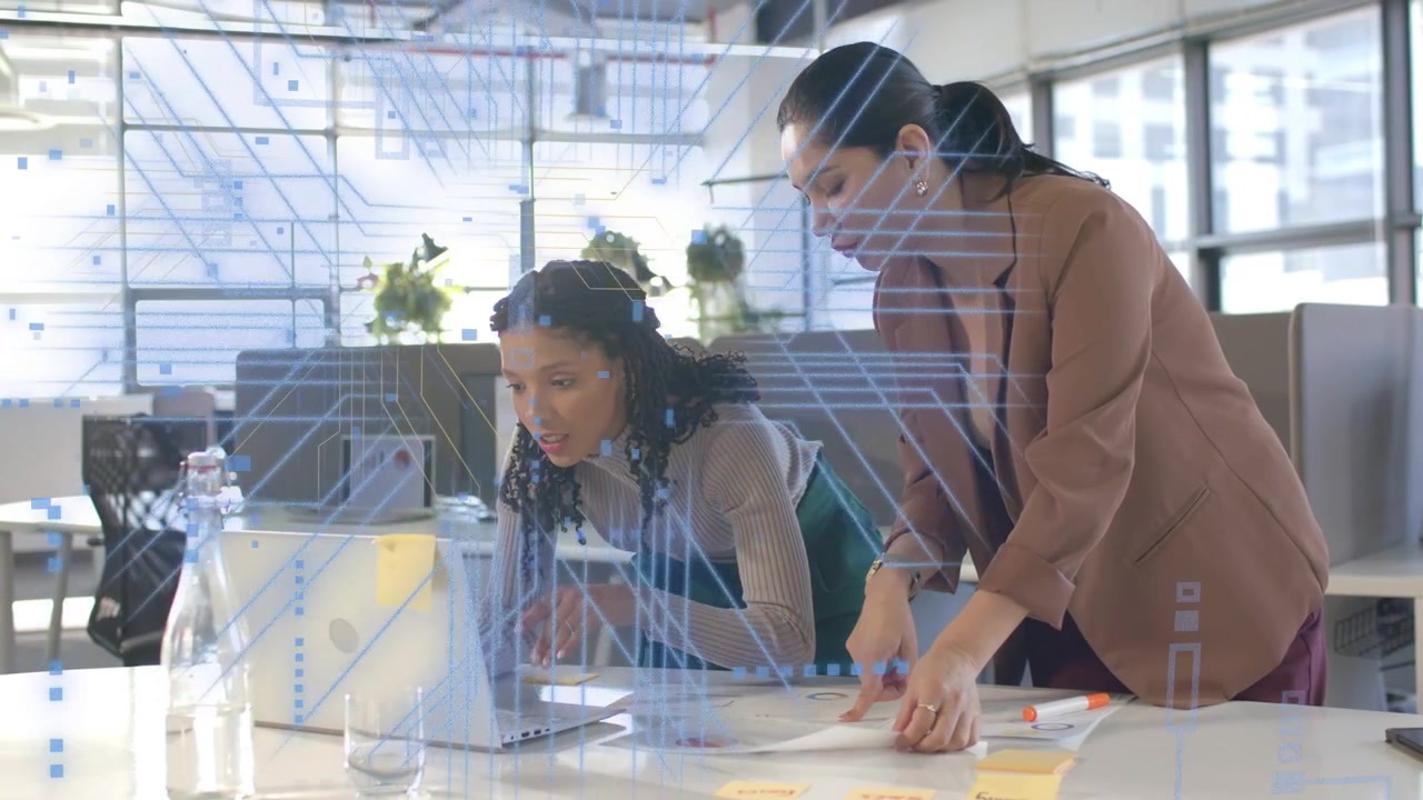 Women working, left typing right pointing charts, tech overlay animating laptop man passing phone