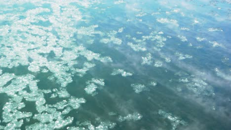 drift ice flowing down the snowy river