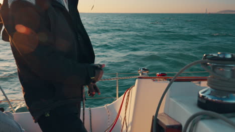 sailing, boat and hands of captain with rope