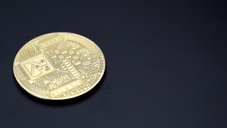 reverse side of a golden bitcoin cryptocurrency turning anticlockwise