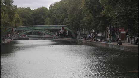 canal scene with bridge and people