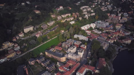 aerial view of a european city with lake and hills