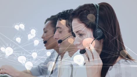 Animation-of-network-of-connection-with-icons-over-business-people-wearing-phone-headsets