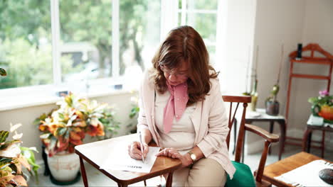 woman doing sudoku puzzle