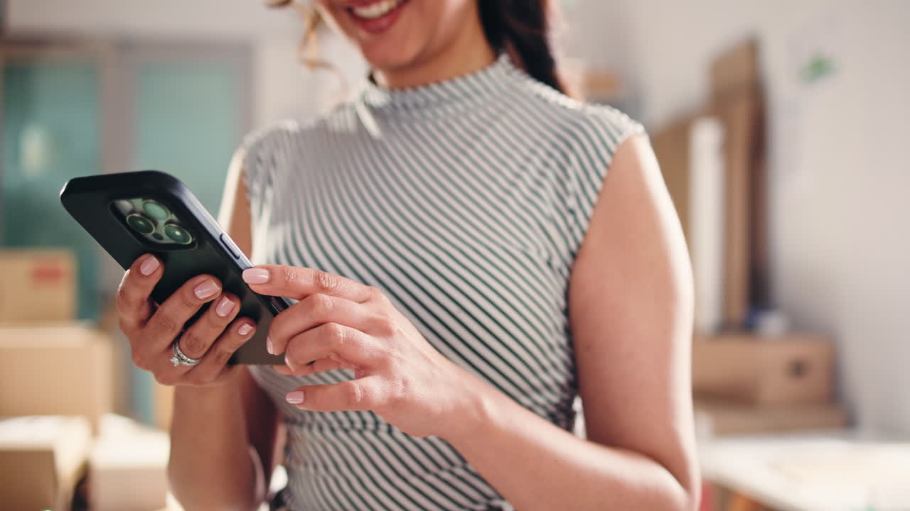 Close-up of Woman's Hands Using Smartphone