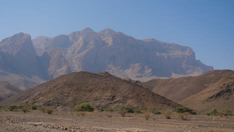 steady driving shot while approaching the jebel shams mountains in the sultanate of oman