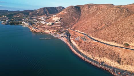scenic coastal highway, desert cliffs and la paz malecón at golden hour