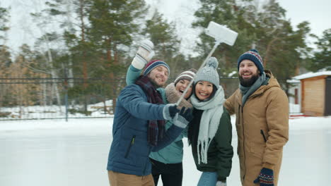 friends taking a selfie at a winter ice rink