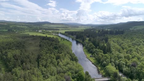 aerial follow shot heading east along the river dee in aberdeenshire