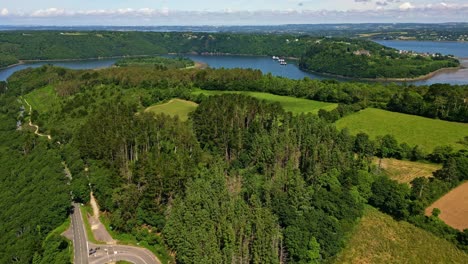 panorama drone view of aulne maritime winding riverside between hills and green forest near the belvédère de térénez, france