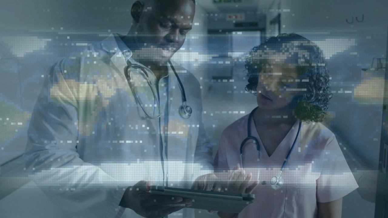 Doctor tapping tablet and pointing, nurse leaning, reviewing patient info with moving overlay