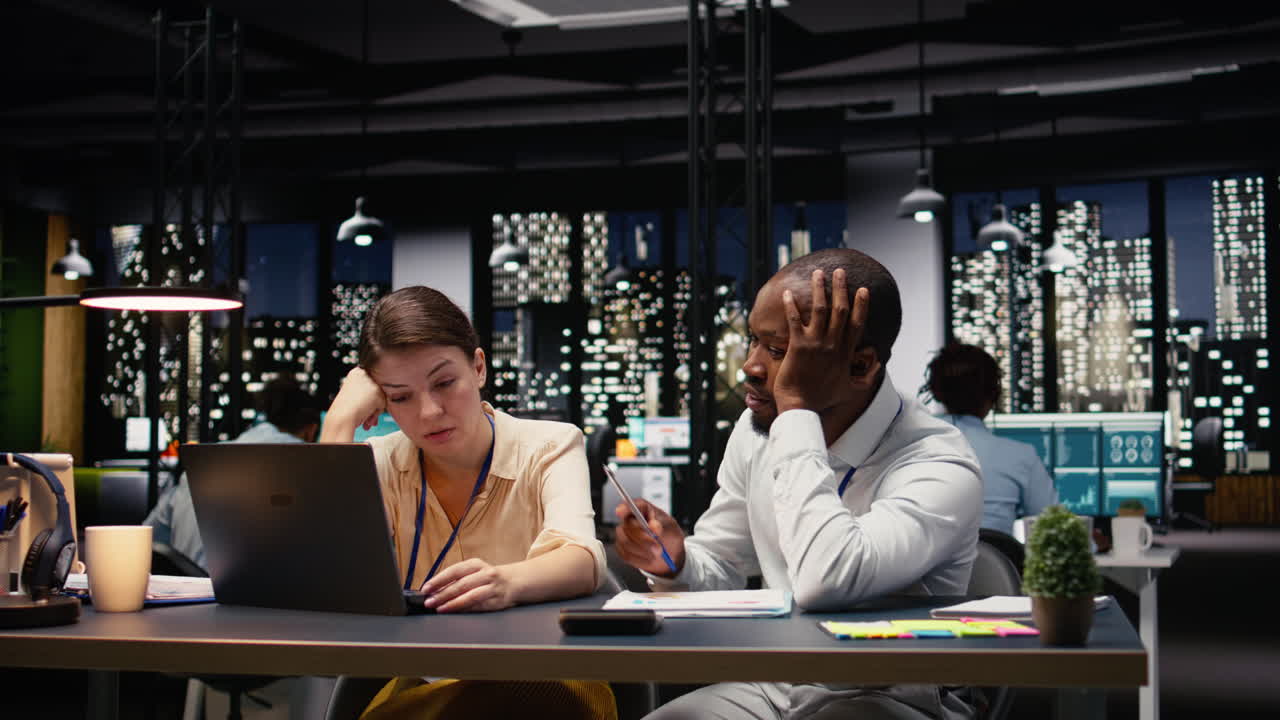 Burnout and frustration, two colleagues struggling to stay awake and solve tasks