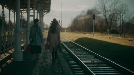 women with luggage walking