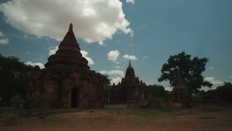 historical ruins of temples in bagan, myanmar taken during the midday with fast moving clouds and no people