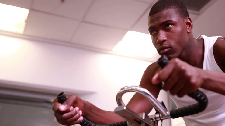 Fit man working out on the exercise bike