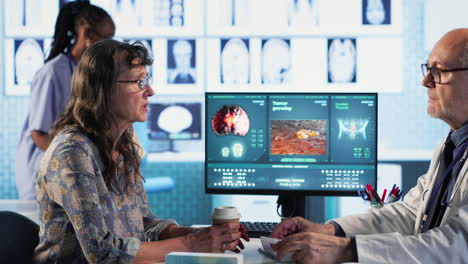 vertical video healthcare expert examine cancer screening scan discussing preventative measures