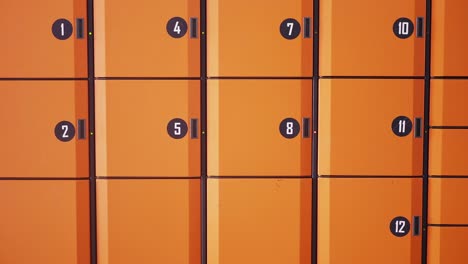 orange storage lockers with numbers