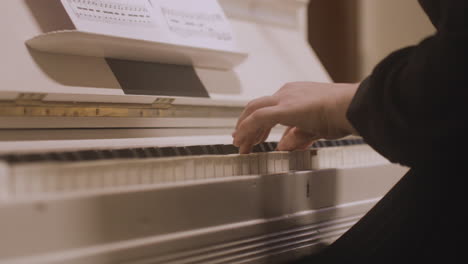 close up of a female hands playing piano