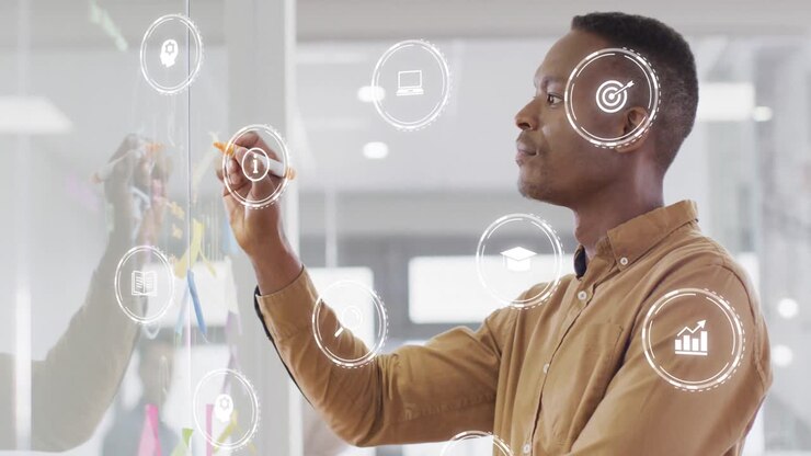 Animation of financial data with icons over african american businessman writing on whiteboard