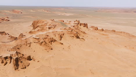 Aerial-View-Of-Flaming-Cliffs-Site-Within-Gobi-Desert-In-Omnogovi-Province-Of-Mongolia