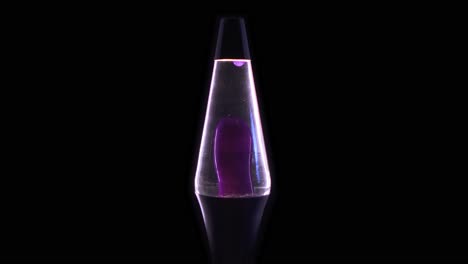 a purple lava lamp isolated on a back background