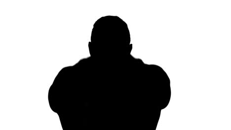 muscular silhouette of man lifting kettlebell