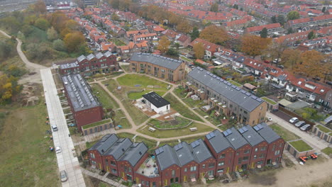 aerial of small, new neighborhood with solar panels on rooftop