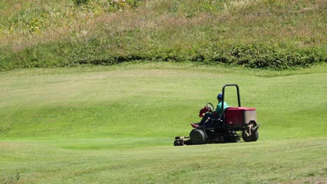 lawn mower operating on a grassy field