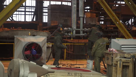 metal foundry workers in action