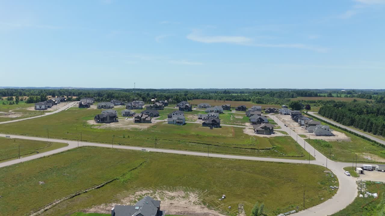 Push in drone shot of new housing development during the day in Caledon, Ontario, Canada