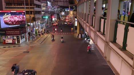 traffic and pedestrians crossing at a city intersection