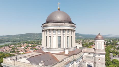 aerial view of the dome of the esztergom basilica, overlooking the danube river bend and the surrounding landscape in hungary. circle dolly