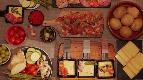 Italian or Spanish restaurant with traditional tapas food, Spanish cuisine, delicious tapas and cheese plate, bruschetta with cheese, olives dry tomatoes and tasty sandwich bar appetizer, buffet