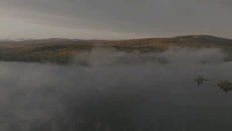 borestone mountain overlooks onawa-lake low cloud cover orbit aerial reveal