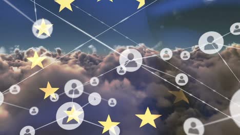 Animation-of-network-of-connections-of-icons-with-people-over-european-union-flag-and-clouds