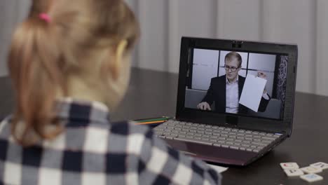 children pupil distance education on laptop. online lesson at home with teacher