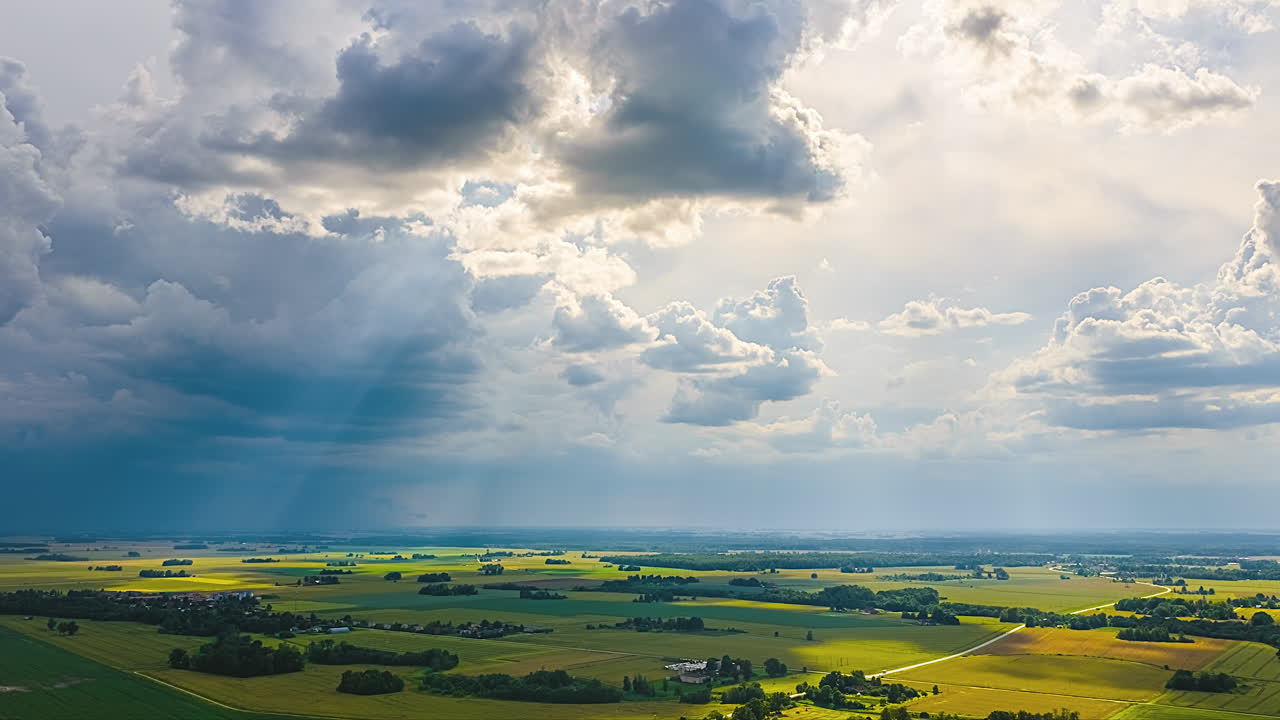Scenic time lapse of a green field being illuminated by sun rays