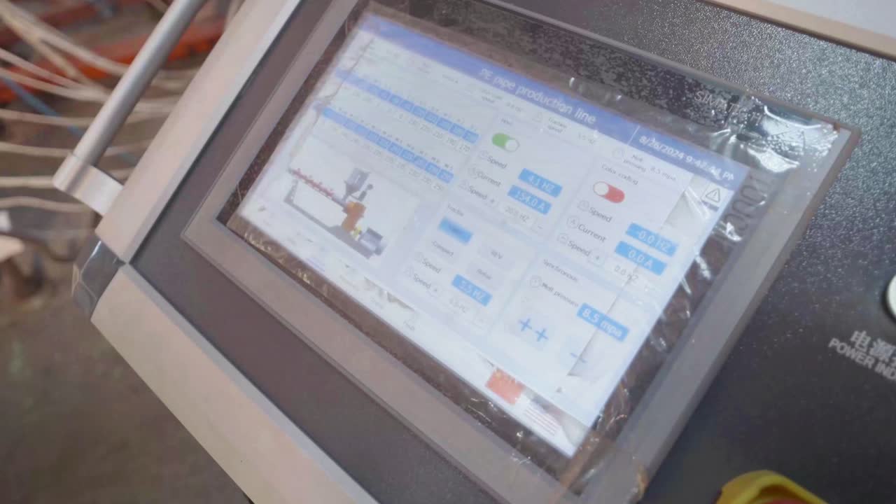 Closeup shot of a display showing details of manufacturing process of PVC pipes in Pipe Industry of Karachi, Pakistan.