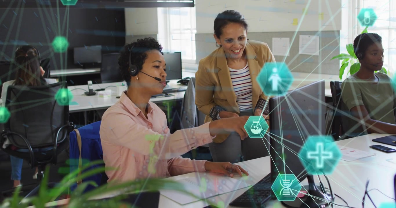 Lead tapping tablet, leaning, customer rep pointing at monitor to resolve issue, teal hexes overlay
