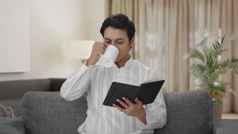 Happy-Indian-man-reading-a-book