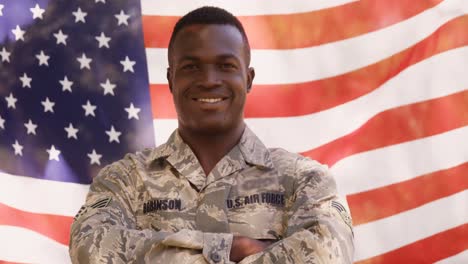 soldier is smiling to the camera with crossed arms