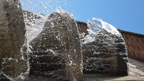 water splashes from stone fountain